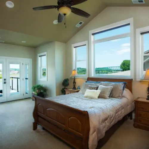 Bright bedroom with large replacement windows and ceiling - noteworthy window replacement project completed by Home Makeover.